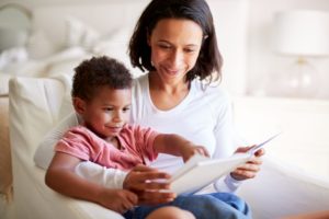 Parent reading with three year old child