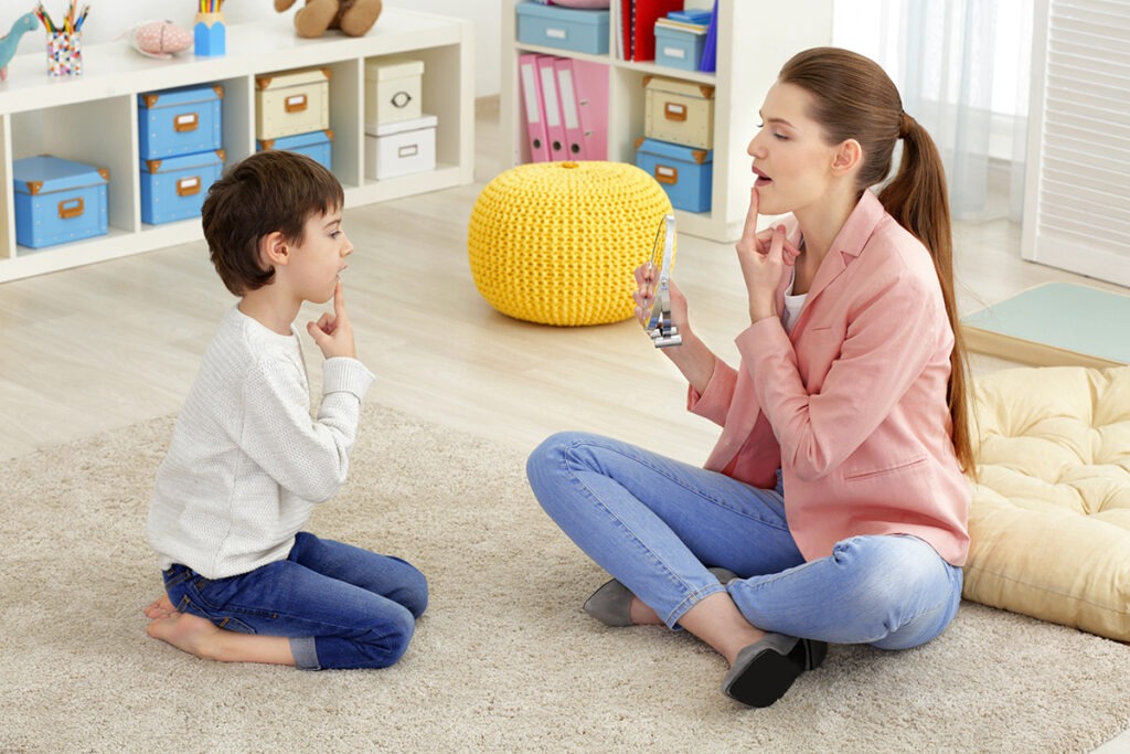 Therapist and Child During Sitting on Floor for a Speech Session