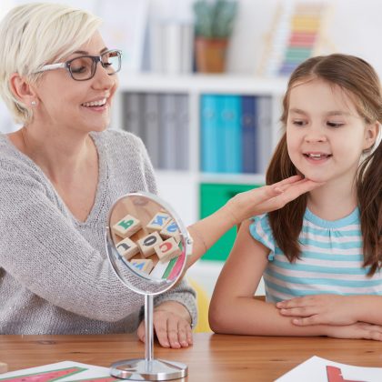 Speech therapist using PROMPT method with school-aged girl