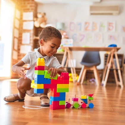 Young Boy Playing Independently with Blocks