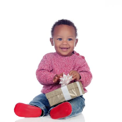 Smiling toddler holding a gift box