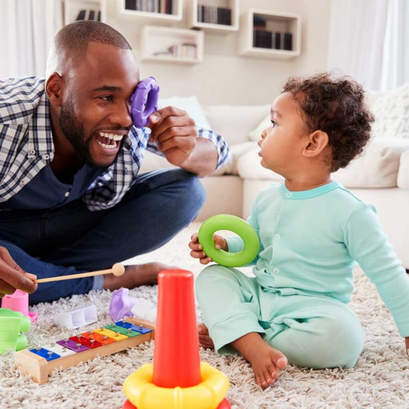 Father Playing Ring Stack With Infant