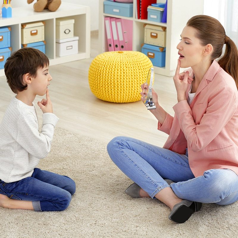 Therapist and Child During Sitting on Floor for a Speech Session